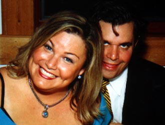 Brother Van leering behind his happy wife Lisa